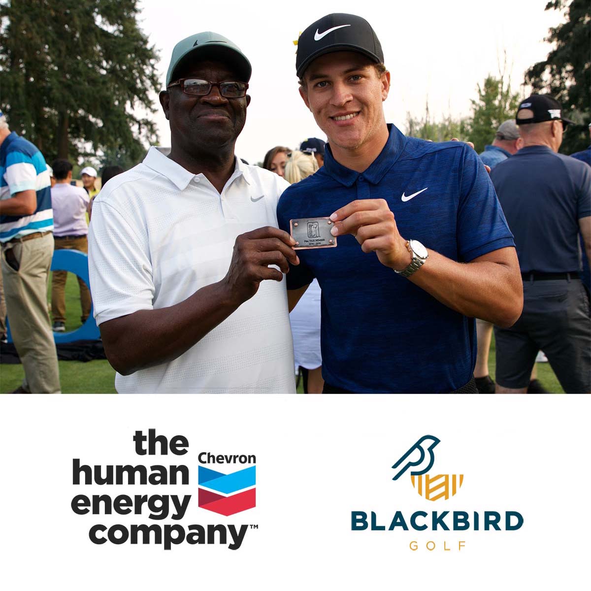 Mack Champ with Cameron Champ holding PGA Tour card